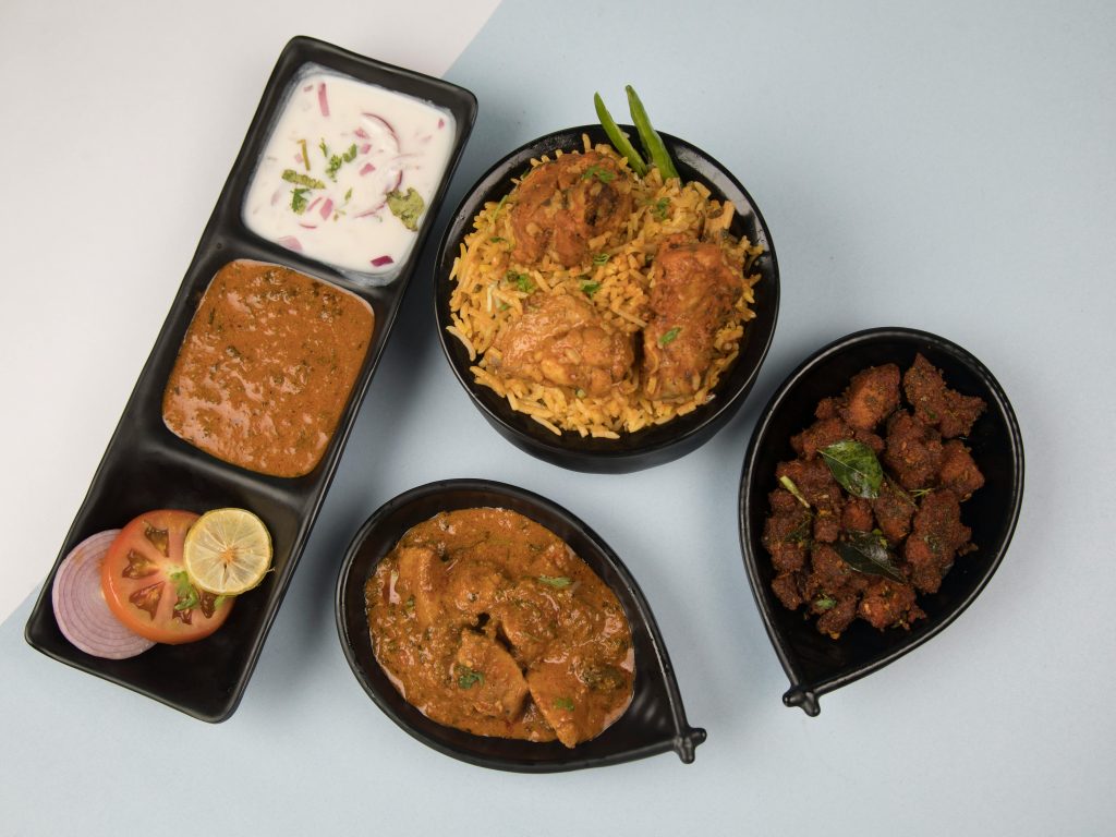 Hot and spicy chicken biryani in a bowl with rich Indian flavors"